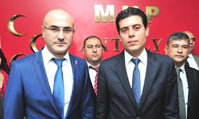 Antalya'da HAS partililer MHP rozeti taktı