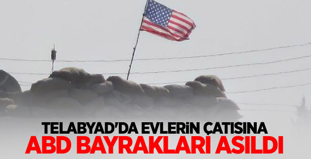 Telabyad'da evlerin çatısına ABD bayrakları asıldı