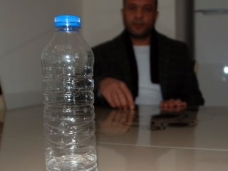 Oğluna attığı şişe silah sayıldı